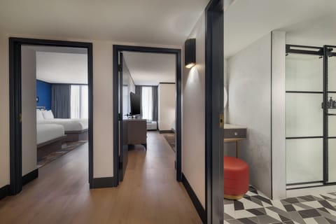 Premium bedding, desk, laptop workspace, blackout drapes