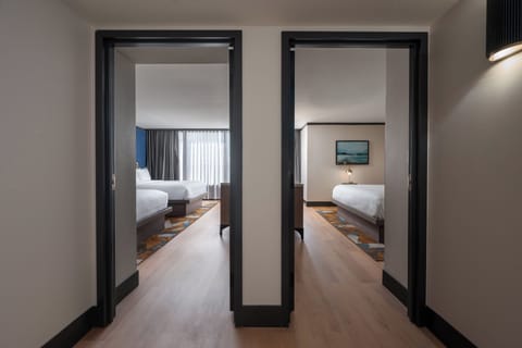 Premium bedding, desk, laptop workspace, blackout drapes