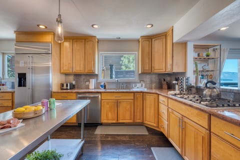 The kitchen features state of the art appliances.