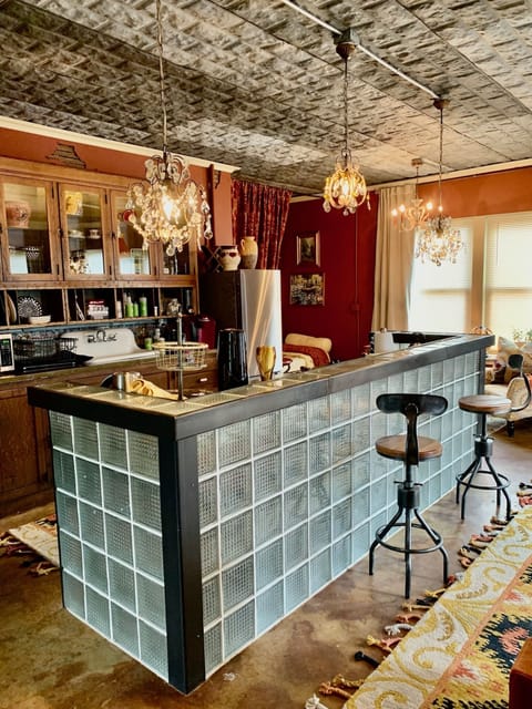 Antique Crystal chandeliers.  Steam punk stools 