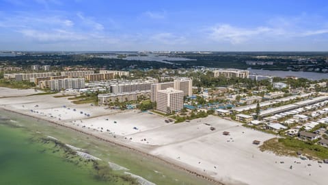 Aerial view of Siesta Key coastline, beach, and surrounding resort buildings