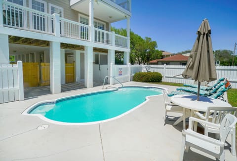 Dive into your private oasis with this sparkling pool surrounded by comfortable loungers, perfect for soaking up the sun or enjoying evening cocktails.