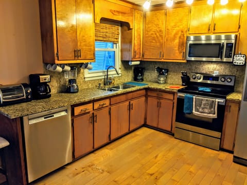 Dishwasher and stainless appliances. Complete w/ dishes, pots, pans and utensils