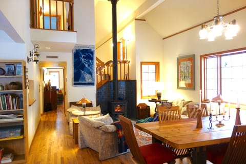 main living room and dining room, kitchen is to the left, stairs and balcony