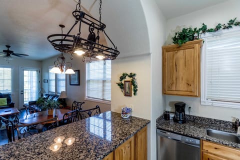 Modern kitchen with granite counters and full-size appliances
