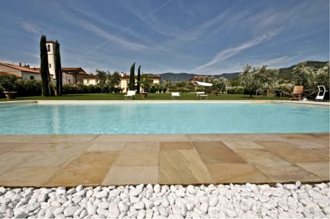 Seasonal outdoor pool, open 9:00 AM to 6:00 PM, pool umbrellas