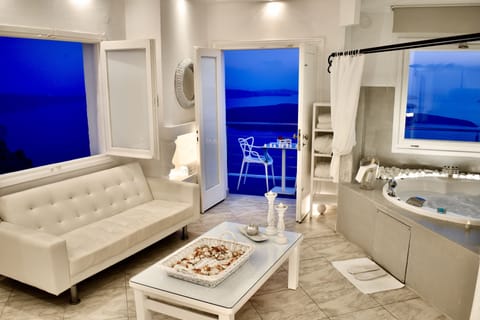 Honeymoon Suite, Jetted Tub, Sea View (Aegeo) | Living area | 24-inch flat-screen TV with satellite channels, TV