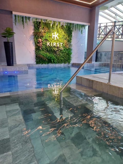 Indoor pool, outdoor pool, pool umbrellas, sun loungers