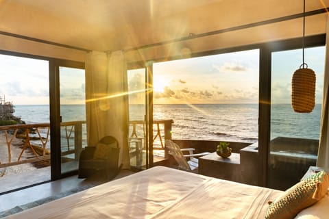 Cielo Master Deluxe Oceanfront king size bed with plunge pool and terrace | Premium bedding, in-room safe, individually decorated