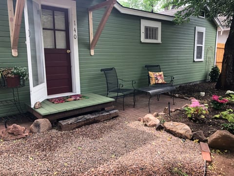 The back of the cottage has a lovely patio to enjoy views of Pikes Peak.
