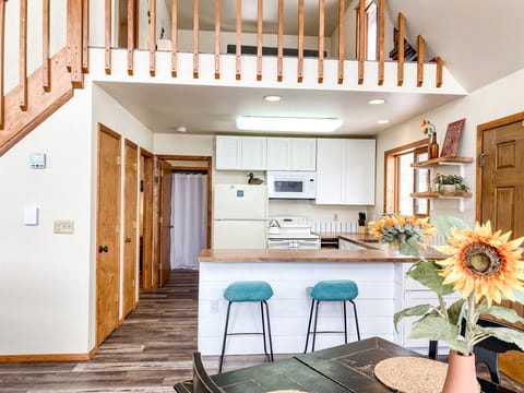 The kitchen peninsula and bar stools make it easy to stay connected when cooking