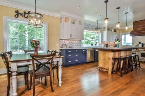 Chef's kitchen with walnut island and plenty of cookware