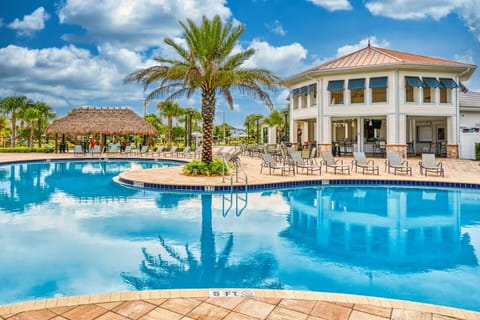 Tropical resort pool with tiki bar