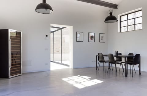 Kitchen 3 with stocked wine fridge and glass tunnel connecting to main house