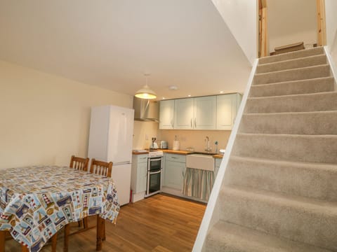 Cottage | Private kitchen | Fridge, highchair, cookware/dishes/utensils