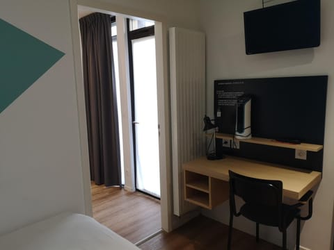 Desk, blackout drapes, bed sheets