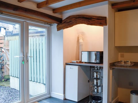 Lovely and spacious kitchen/diner with patio doors to the garden | Noddfa Cottage, Llanfairtalhaiarn, near Abergele