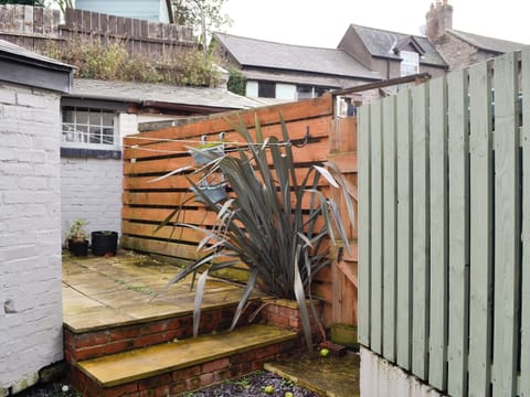 Paved patio area to the rear | Noddfa Cottage, Llanfairtalhaiarn, near Abergele