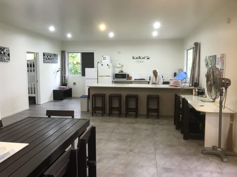 View from dining to the kitchen, with the 3 bedroom to the left.