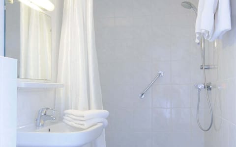 Shower, free toiletries, towels, soap