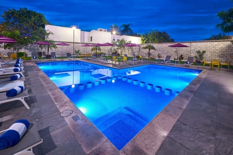 Outdoor pool, open 8:00 AM to 8:00 PM, pool umbrellas, sun loungers