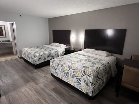 Desk, laptop workspace, blackout drapes, iron/ironing board