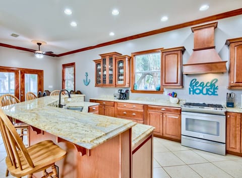 1st Floor - 🍽️ Gourmet kitchen with bar seating and stainless steel appliances