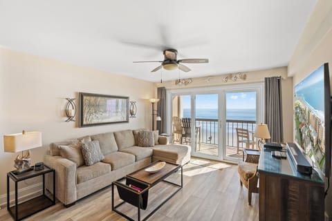 Let in the sun rays as you relax in the comfort of this living room with a view.