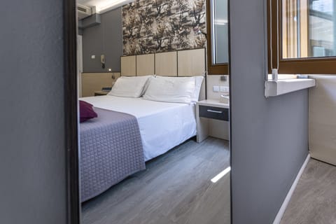 Double or Twin Room | Minibar, in-room safe, desk, blackout drapes