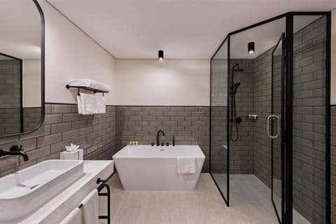 Suite, 2 Bedrooms | Bathroom | Shower, free toiletries, hair dryer, bathrobes