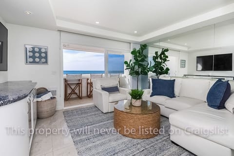 View of Living Room looking out towards the balcony and Ocean