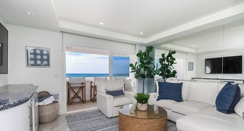 View of Living Room looking out towards the balcony and Ocean