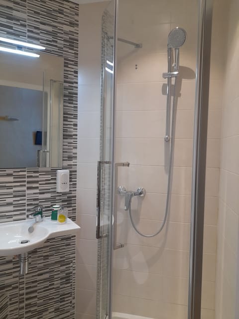 Shower, free toiletries, hair dryer, towels