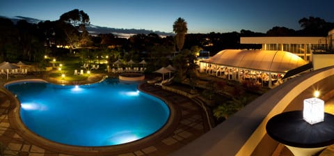 Outdoor pool, open 7:00 AM to 7:00 PM, pool umbrellas, sun loungers