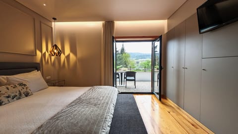 Double Room | Minibar, blackout drapes, iron/ironing board, bed sheets