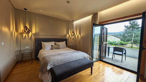 Double Room | Minibar, blackout drapes, iron/ironing board, bed sheets