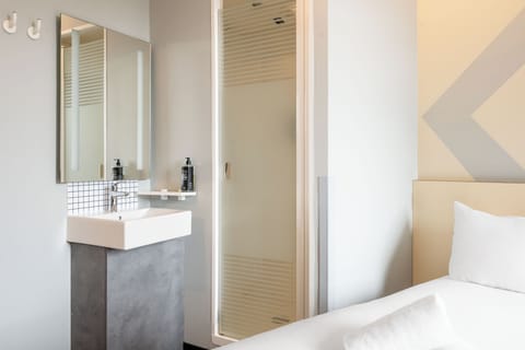 Shower, eco-friendly toiletries, hair dryer, towels