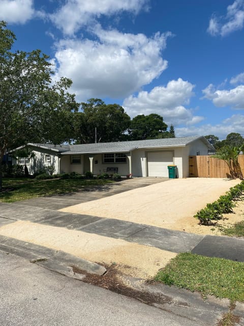 Front yard with new crushed coquina extra parking area 