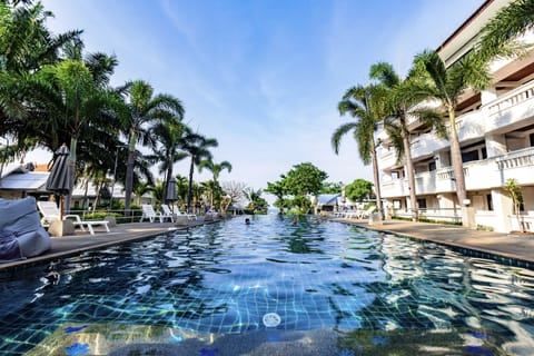 Outdoor pool, open 7:00 AM to 7:00 PM, pool umbrellas, sun loungers