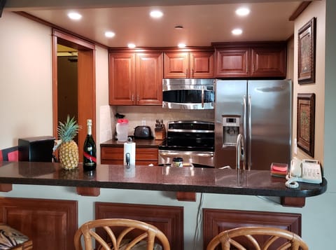 Beautiful open kitchen with recessed LED lighting on dimmer switches.