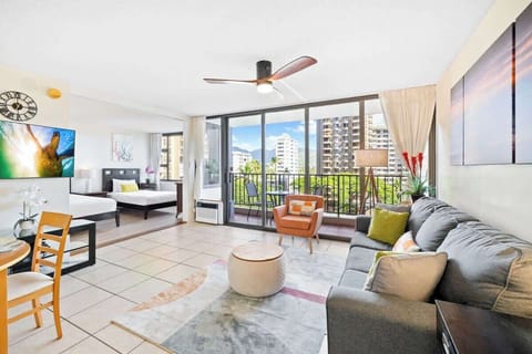 Great condo with a Samsung Smart TV, ceiling fan, and a sliding door that separates the bedroom from the living room.