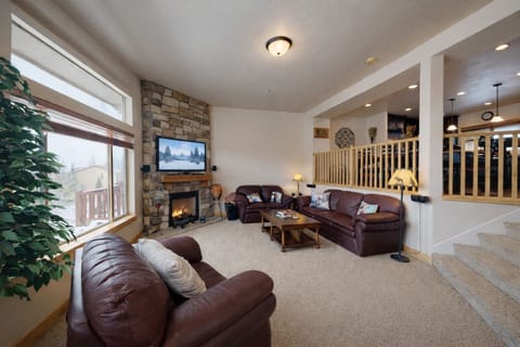 Unwind in this spacious mountain retreat featuring plush leather seating and a cozy stone fireplace. Large windows frame stunning views, making it the perfect year-round Park City escape.