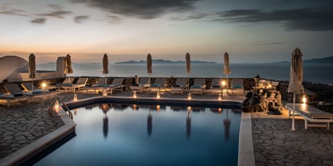 Seasonal outdoor pool, open 9:00 AM to 9:00 PM, pool umbrellas