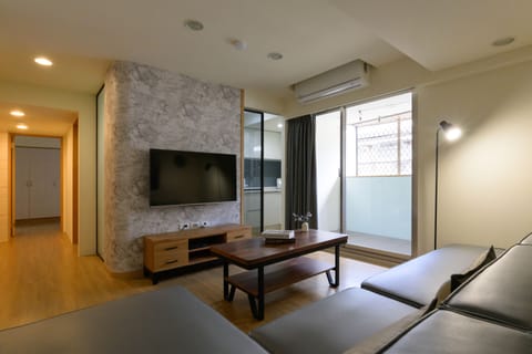 Bright and Spacious Living Room: 
• 50" Flat Screen TV 
• Large Comfy Sofa 
