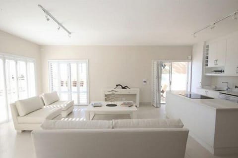 Deluxe Apartment, 3 Bedrooms, Kitchen, Ocean View | Living area | 110-cm flat-screen TV with satellite channels, TV