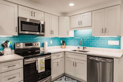 Beautiful Kitchen with Stainless Steel Appliances and Quartz Countertops