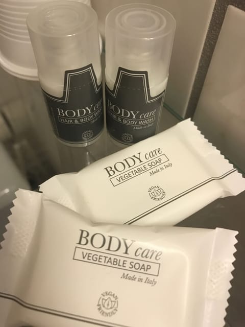 Shower, rainfall showerhead, hair dryer, towels