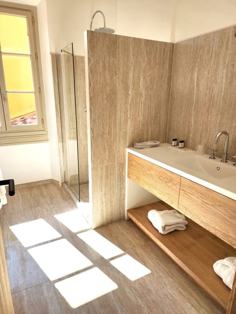 Junior Suite, Balcony | Bathroom | Rainfall showerhead, designer toiletries, hair dryer, bathrobes