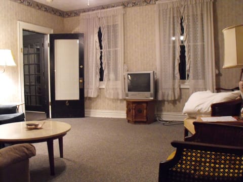 Suite, 2 Bedrooms | Living area | 32-inch flat-screen TV with cable channels, TV