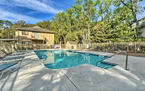 Our pool with plenty of seating, umbrellas and sun deck.